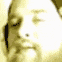 A man's face rapidly fading into an intense, blinding white light.