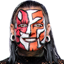 Jeff Hardy smiling with his signature red, orange, and white face paint.
