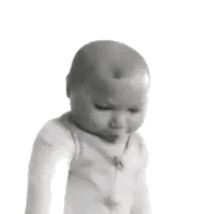Baby looking down with a skeptical and unimpressed facial expression.