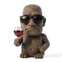 A stone Moai statue wearing black sunglasses and holding a glass of red wine.