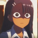 Nagatoro with a blank, wide-eyed expression of shock and disbelief.