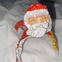 Santa Claus with a distorted, low-quality face and a chaotic expression.