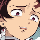 Tanjiro Kamado with wide, terrified eyes and a trembling mouth expressing extreme shock.