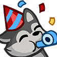 A gray wolf wearing a red and blue striped party hat while blowing a blue party horn with confetti in the background.