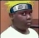 Person wearing a headband looking sideways with a confused and uncomfortable expression.