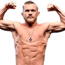 Fighter flexing his biceps and showing off his muscular physique.