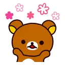 Rilakkuma bear looking happy with pink flowers floating around its head.