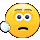 Yellow smiley face tapping its temple with a gloved hand to imply stupidity.