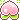 Four small, pink pixelated peaches with green leaves and sparkles floating above them.