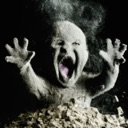 A baby emerging from a pile of ash with a wide open mouth and raised hands in a state of shock.