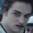 Edward Cullen looking with a suspicious and disgusted facial expression.