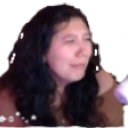 A woman with long dark hair looking visibly sad and upset.