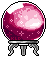 Crystal ball sitting on a silver stand with a glowing pink interior and sparkles.