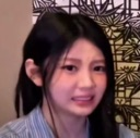 Wonhee from ILLIT making a disgusted and cringing facial expression.