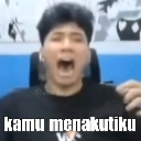 Young man with a wide open mouth looking terrified with the text kamu menakutiku overlaid.