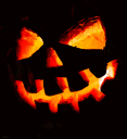 Jack-o'-lantern with a glowing, mischievous carved face against a black background.