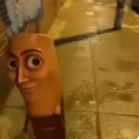 Sausage with a human face staring intensely with wide eyes.