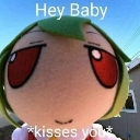 A green-haired Fumo plushie with large red eyes and a text overlay that says Hey Baby *kisses you*.