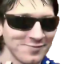 Lionel Messi wearing dark sunglasses with a smug, confident expression.