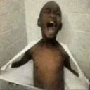 A young child screaming with their mouth wide open while holding a white towel up to their chest.