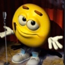 Yellow smiley face shrugging its shoulders in front of a microphone on a stage.