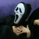 Ghostface mask clutching its chest in a dramatic, shocked pose.