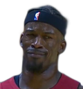 Jimmy Butler wearing a headband and giving a skeptical, unimpressed side-eye expression.