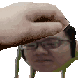 A hand rhythmically petting the head of a person wearing glasses.