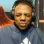IShowSpeed wearing headphones with a confused and annoyed facial expression.