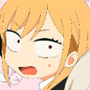 Marin Kitagawa with a suspicious, squinting expression and a slightly open mouth.