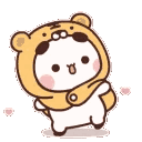 A cute white bear cub wearing a bear-themed hood spinning around happily.