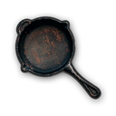 Cast-iron frying pan viewed from above against a black background.
