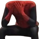 Spider-Man sitting with his head missing while holding his hands to his neck in a pose of despair.