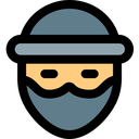 Hacker wearing a hat and mask with a serious expression.