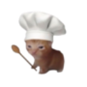 A small orange kitten wearing a white chef hat and holding a wooden spoon.