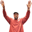 Kanye West with his hands raised in the air.