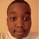 Person with a neutral, direct facial expression looking straight at the camera.