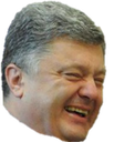 Man with gray hair laughing with a wide, mischievous grin.