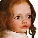 Doll with large, wide eyes staring with a blank and confused expression.