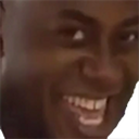 Ainsley Harriott making a mischievous and satisfied facial expression.