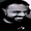 Man with a dark, grainy, and highly expressive smug grin.
