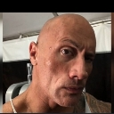 Dwayne The Rock Johnson looking directly at the camera with a single raised eyebrow.