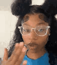 Person with glasses blowing a kiss in a four-panel sequence.
