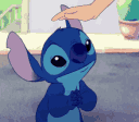 Stitch from Lilo & Stitch closing his eyes and smiling while receiving gentle head pats from a hand.