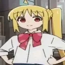 Nijika Ijichi with blonde hair and a red bow standing with hands on her hips looking smug.
