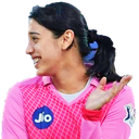 A woman in a pink jersey smiling and shrugging with one hand raised.