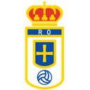 Real Oviedo football club crest featuring a crown, a blue shield with a yellow cross, and a soccer ball.