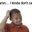 A young boy scratching his head with a skeptical expression and the text damn i kinda dont care above him.