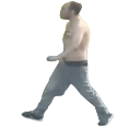 A shirtless man walking with a confrontational and bold posture.