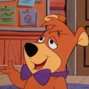 Boo-Boo Bear looking up with a smug, self-satisfied expression while gesturing with his hand.